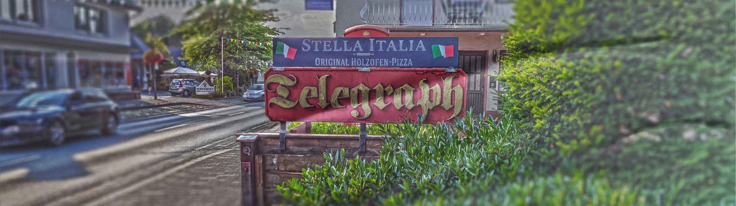 Schild der Pizzeria Stella Italia an der Hauptstraße in Schloß Holte-Stukenbrock